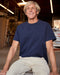 Man wearing navy blue short sleeve t-shirt