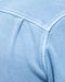 Close-up of a light blue fabric with stitching detail